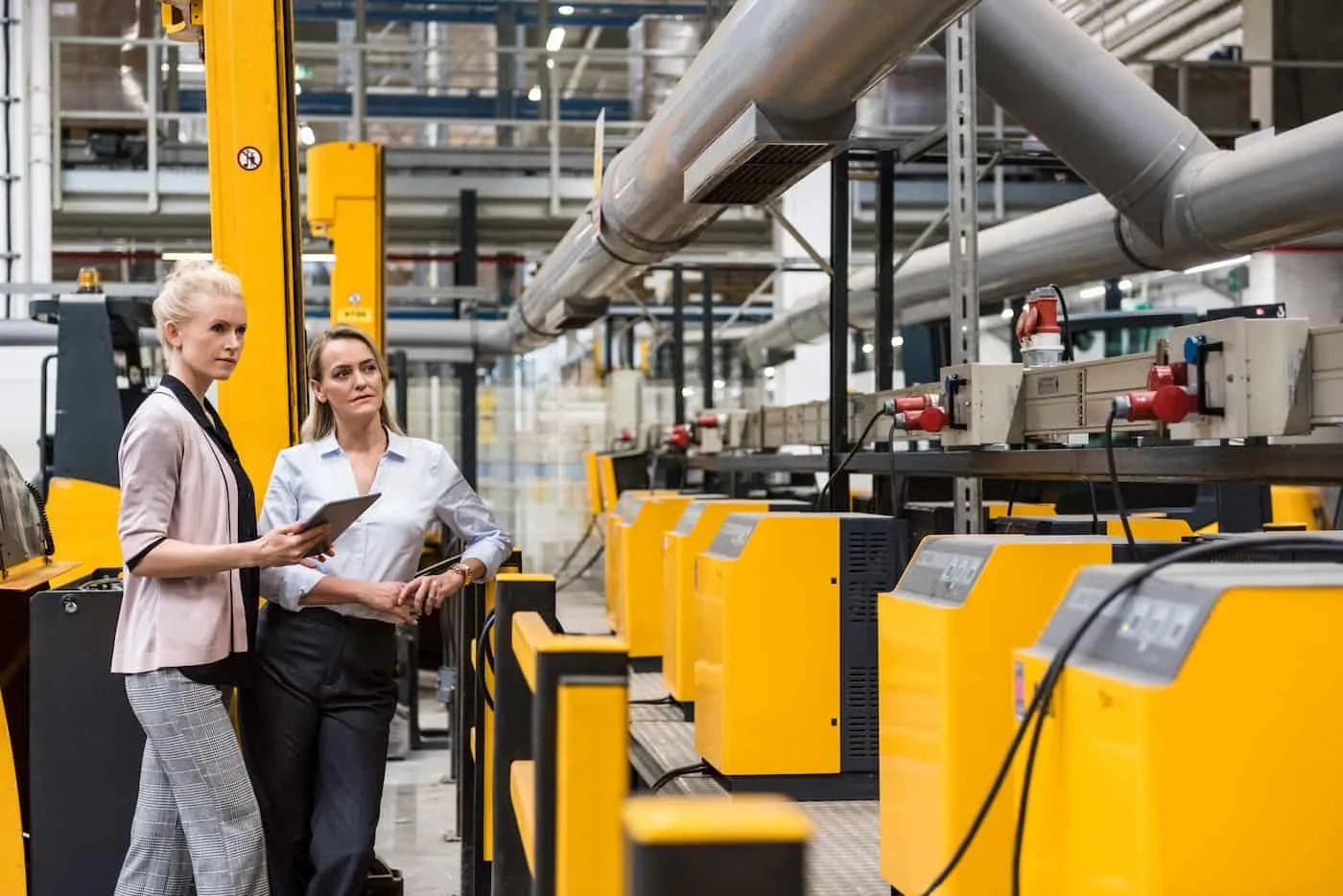 Women checking lean manufacturing process. Women checking lean manufacturing process.